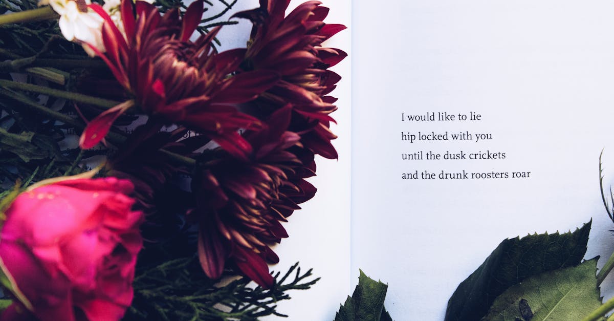 A beautiful floral arrangement alongside an introspective poem on an open book.