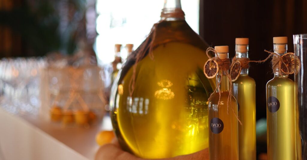 Close-up of olive oil bottles and lemons on a shelf with warm lighting.