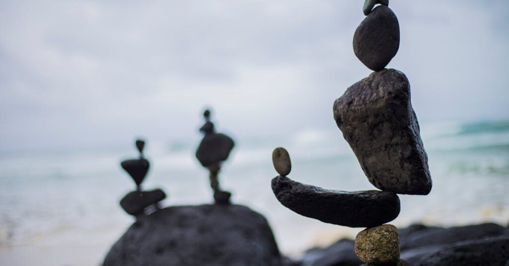 Artistic rock balancing on a serene beach in Fingal Head, NSW, Australia.